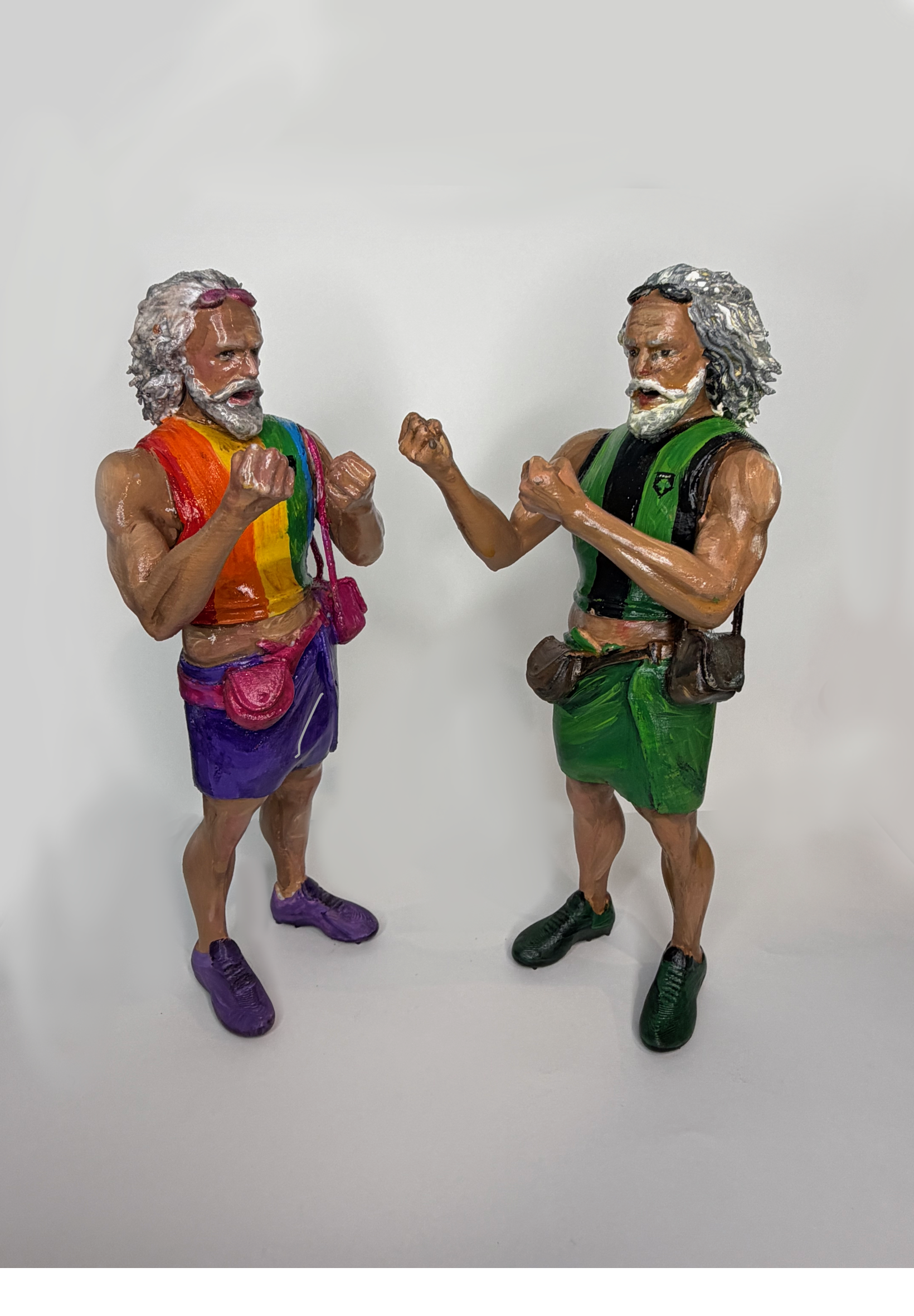 Two Little Leslie players facing each other, one in a Pride kit and one in an Austin kit.